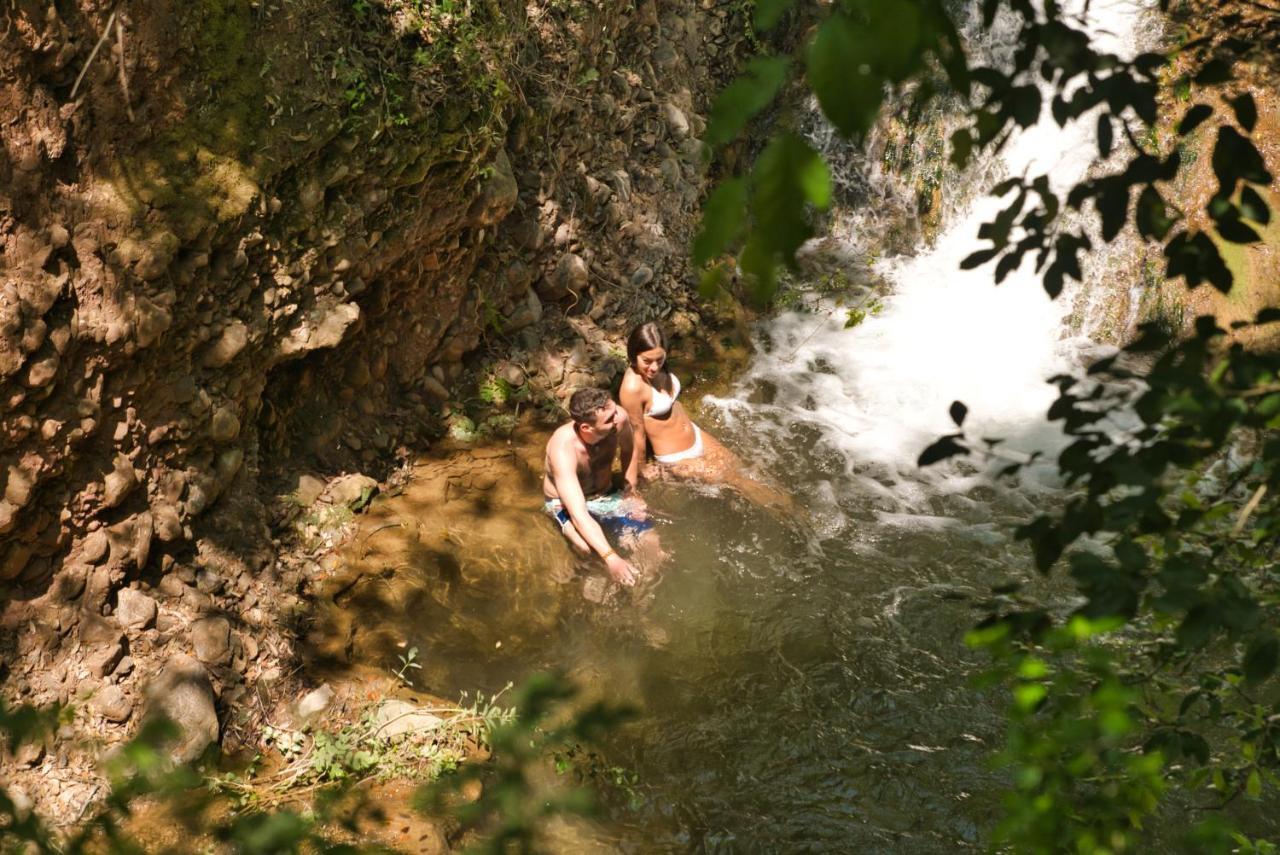 The Sense Experience Resort Follonica Esterno foto Swimming at the bottom of the waterfall